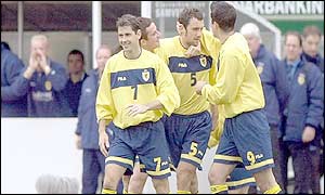 The Scotland team celebrate their opening goal