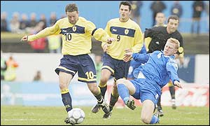 Scotland's Paul Lambert hustle's for the ball