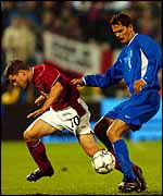 Michael Owen is muscled off the ball by Marian Zeman