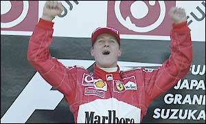 Michael Schumacher celebrates victory