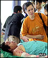 A woman waits for her injured relative at Sanglah general hospital in Denpasar