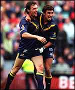 Australia's Daniel Kerr and Angelo Lekkas, left, celebrate at the end Ireland v Australia International Rules Series.