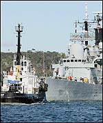 HMS Nottingham with tug-boat tow