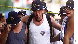 Australian tourists weep as the leave the site of the blast 