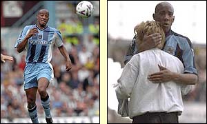 Dion Dublin chases a long ball and embraces then Coventry manager Gordon Strachan in 1997