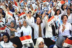 Iraqis chant slogans and wave national flags in support of President Saddam Hussein. AFP