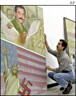 Iraqi painter shows anti-US picture alongside one of Saddam Hussein