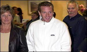 Baxter arrives at the press conference with his mum Sue Dixon