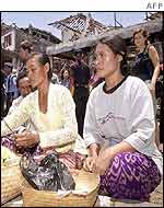 Balinese women pray at the bomb site