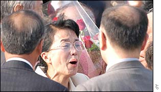 Fukie Hamamoto (centre) being greeted by family members