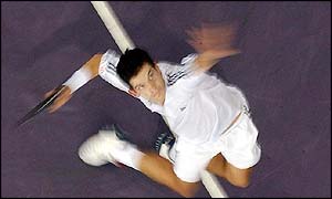 Tim Henman serves to Thailand's Paradorn Srichaphan