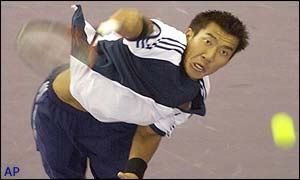 Paradorn Srichaphan serves to Tim Henman during the second set