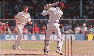Glenn McGrath bowls West Indies' Courtney Walsh in Bridgetown