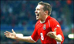 Craig Bellamy celebrates his winning goal