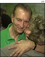 Edward Seaga hugging his wife