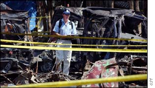 Australian policewoman investigates at the bomb blast site 