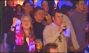 Woman fan celebrates first goal