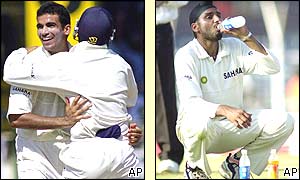Zaheer Khan is congratulated on a wicket as Harbhajan Singh drinks some water
