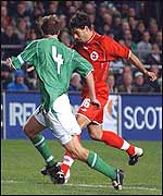 Fabio Celestini's gets ready to hammer in Switzerland's late winner despite Cunningham's attentions