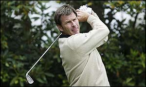 Nick Faldo plays a shot in the growing gloom as the play-off continues