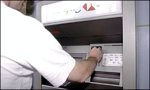 A man at a cash point machine
