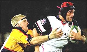 Toulouse's Fabien Pelous runs past a Newport defender