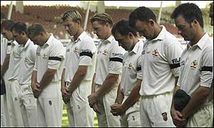The Australian team observe a minute's silence prior to the third Test