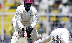 Ridley Jacobs, the West Indian wicketkeeper, runs out India's last man Zaheer Khan