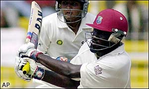 Wavell Hinds hits a boundary during his innings of 61