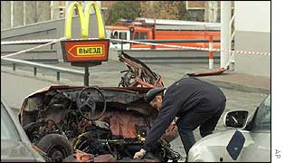 Policeman examines wreckage