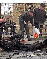 Investigators collect debris