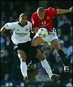 Fulham's Alain Goma and Manchester United's Mikael Silvestre