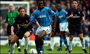 Chelsea's Emmanuel Petit keeps a close eye on Manchester City's Marc-Vivien Foe