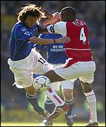 Everton's Li Tie and Arsenal's Patrick Vieira battle for the ball 