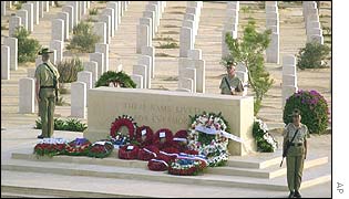 British soldiers stand guard near wreaths 