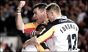 Bradford captain Robbie Paul is hugged by Michael Withers and Mike Forshaw