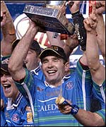 St Helens captain Chris Joynt lifts the trophy