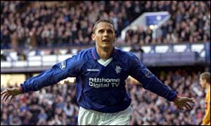 Peter Lovenkrands runs to the crowd after scoring Rangers' second goal 