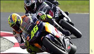 Rossi surges away from Barros on the last lap