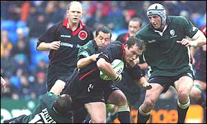 Barry Everitt tackles Edinburgh's Alastair Dickson with the assistance of Brendan Venter