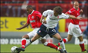 Charlton's Shaun Bartlett battles with Boro's Jonathan Greening