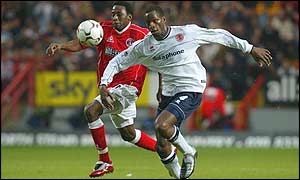 Charlton's Jason Euell battles for the ball with Middlesbrough's Ugo Ehiogu
