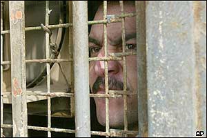 A death row prisoner looks from his cells