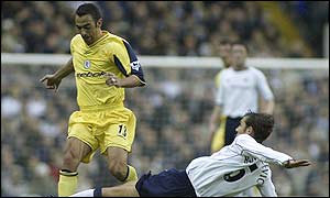 Bolton's Youri Djorkaeff gets tangled up in Spurs' defence