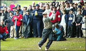 Fans watch as Spain's Sergio Garcia tees-off on the 17th hole