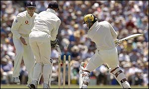 John Crawley and Alec Stewart look on as Brad Hogg of the ACB XI is bowled for a duck