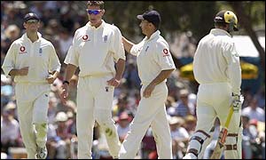 England captain Nasser Hussain congratulates spin bowler Ashley Giles after he took the wicket of Brad Hogg