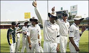 The Australian team walk off to applause