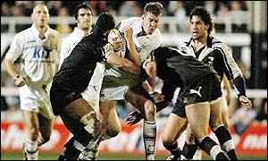 Hull's Scott Logan is tackled by the New Zealand defence