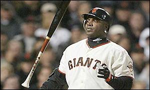 Barry Bonds tosses his bat away in disgust after striking out in the third innings